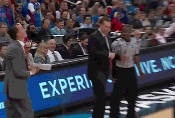 A Man In A Suit Stands In Front Of A Blue Sign That Says Experi GIF