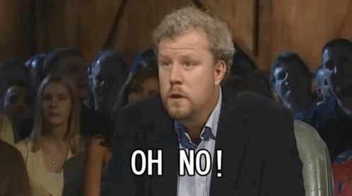 A Man In A Suit Stands In Front Of A Crowd And Says Anyway GIF