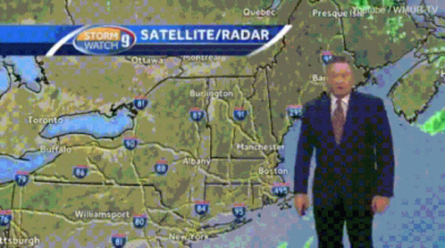 A Man In A Suit Stands In Front Of A Map That Says Storm Watch 9 Satellite Radar GIF
