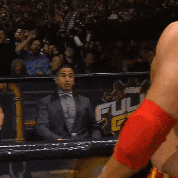 A Man In A Suit Stands In Front Of A Sign That Says " Full " GIF