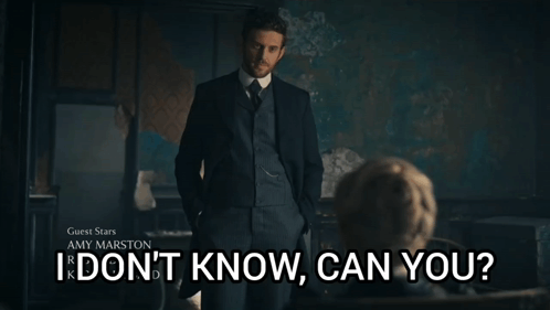 A Man In A Suit Stands In Front Of A Sign That Says Guest Stars Amy Marston I Don 'T Know Can You GIF