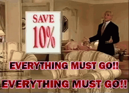 A Man In A Suit Stands In Front Of A Sign That Says " Save 10 % " GIF