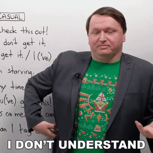 A Man In A Suit Stands In Front Of A White Board With Casual Written On It GIF