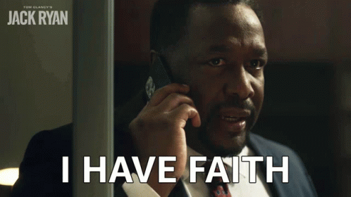 A Man In A Suit Talking On A Cell Phone With The Words I Have Faith Below Him GIF