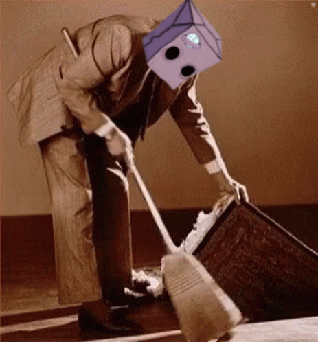 A Man In A Suit With A Box On His Head Is Sweeping The Floor . GIF
