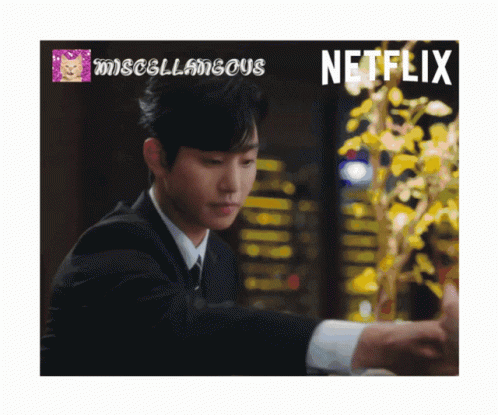 A Man In A Suit With A Netflix Logo In The Corner GIF