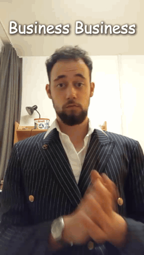 A Man In A Suit With The Words Business Business Written Above Him GIF