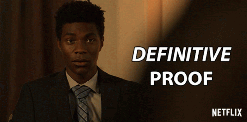 A Man In A Suit With The Words Definitive Proof Above Him GIF