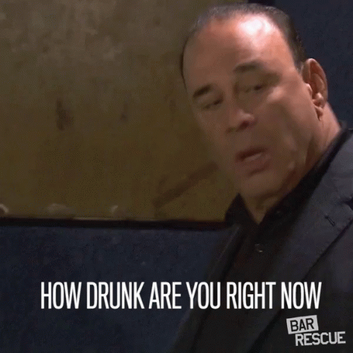 a man in a suit with the words how drunk are you right now
