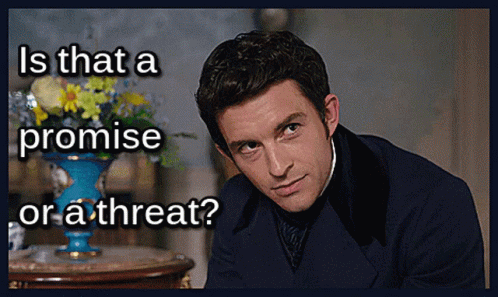 A Man In A Suit With The Words Is That A Promise Or A Threat Written Below Him GIF