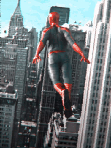 A Man In A Superhero Costume Is Flying Through The Air Over A City GIF