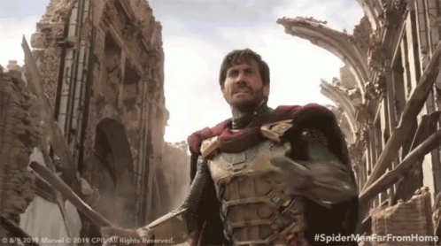 A Man In A Superhero Costume Is Standing In Front Of A Ruined Building With The Hashtag #Spidermenfarfromhome GIF
