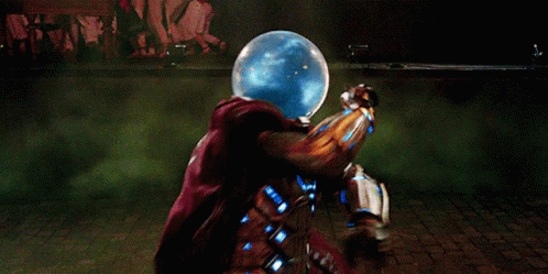 A Man In A Superhero Costume Is Surrounded By Green Smoke GIF