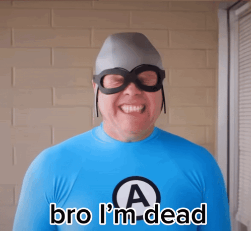 A Man In A Superhero Costume Says " Bro I 'M Dead " In Front Of A Brick Wall GIF