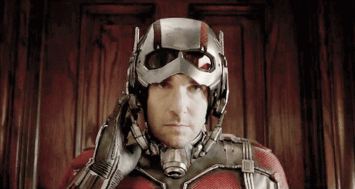 Man In Superhero Costume With Helmet On GIF