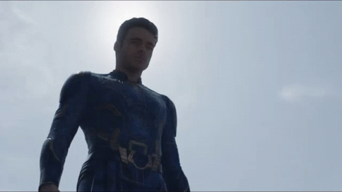 A Man In A Superhero Suit Has A Light Beam Coming Out Of His Eye GIF