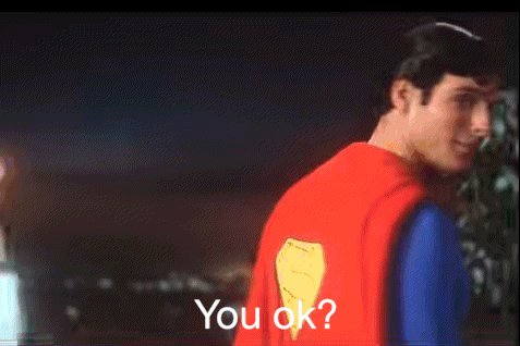 A Man In A Superman Costume Is Asking If You Are Ok GIF