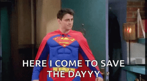 A Man In A Superman Costume Is Standing In Front Of A Door And Saying Here I Come To Save The Day . GIF