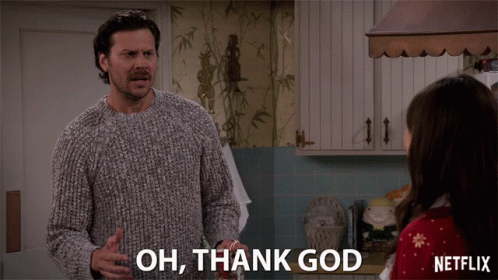 A Man In A Sweater Says " Oh Thank God " In Front Of A Woman GIF