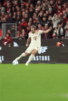 A Man In A T-Mobile Jersey Kicking A Soccer Ball On A Soccer Field GIF