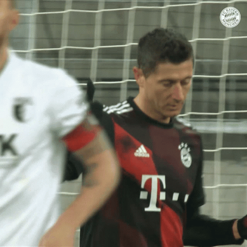 A Man In A T-Mobile Jersey Stands In Front Of A Soccer Net GIF