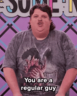 A Man In A T-Shirt That Says You Are A Regular Guy GIF