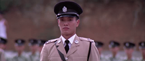 A Man In A Tan Uniform Has A Badge On His Hat That Says ' A ' On It GIF