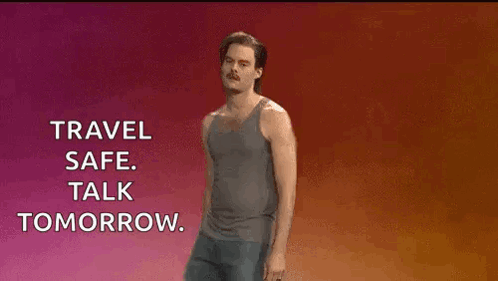 A Man In A Tank Top And Shorts Is Standing In Front Of A Sign That Says Travel Safe Talk Tomorrow GIF
