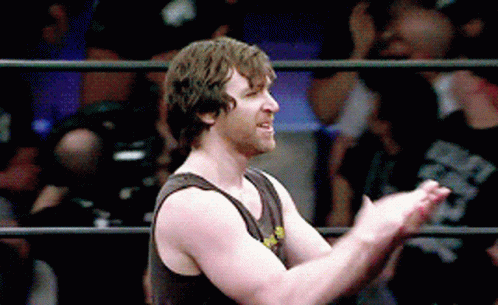 A Man In A Tank Top Is Clapping In A Ring GIF