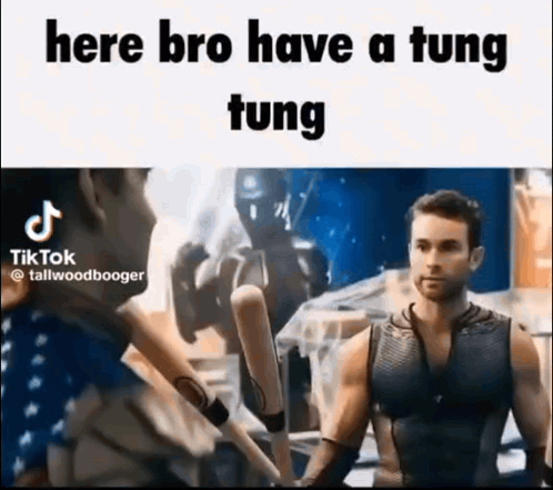 A Man In A Tank Top Is Holding A Bunch Of Baseball Bats In His Hands . GIF