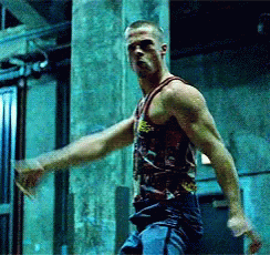 A Man In A Tank Top With A Skull And Crossbones Design On It GIF