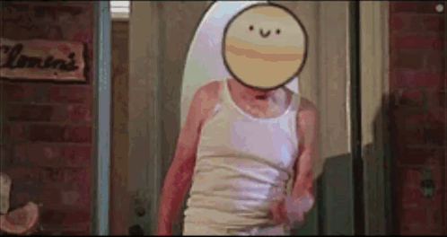 A Man In A Tank Top With A Smiley Face On His Face Is Standing In Front Of A Mirror . GIF