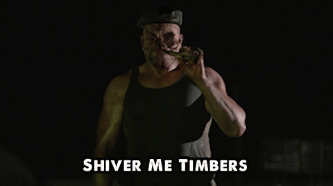 A Man In A Tank Top With The Words " Shiver Me Timbers " Above Him GIF