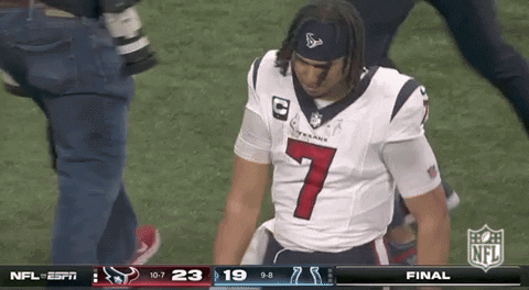 A Man In A Texans Jersey Is Kneeling On The Field GIF
