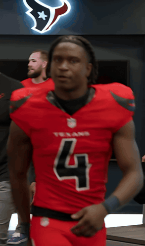 A Man In A Texans Jersey With The Number 4 On It GIF