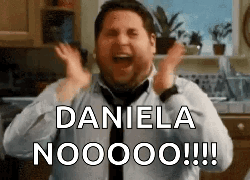 A Man In A Tie Is Screaming With His Hands In The Air And Says Daniela Nooooo !!! GIF