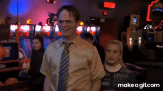 a man in a tie stands next to a woman in a make a gif.com image