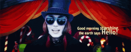 A Man In A Top Hat And Sunglasses Says " Good Morning Starshine The Earth Says Hello " GIF