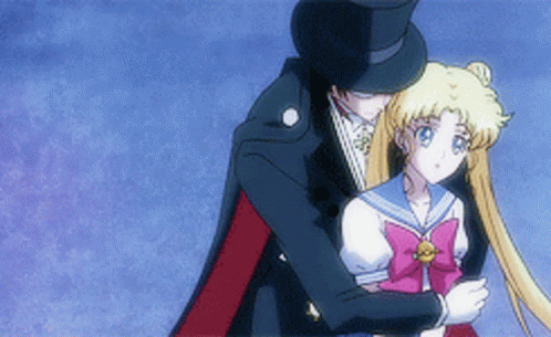 A Man In A Top Hat Holds A Girl In A Sailor Outfit GIF