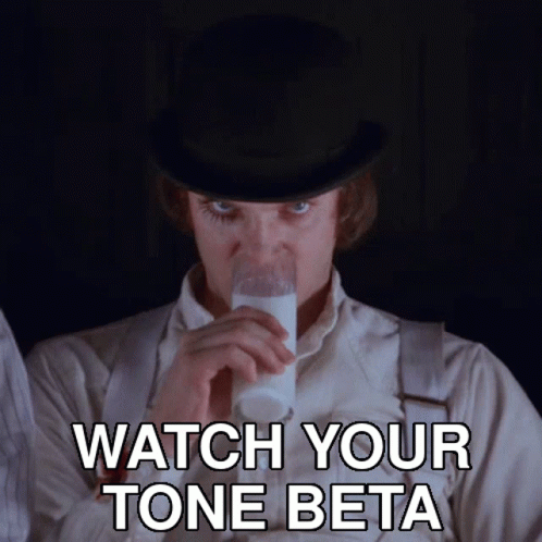 A Man In A Top Hat Is Drinking A Glass Of Milk With The Words Watch Your Tone Beta Below Him GIF