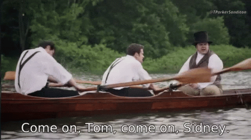 A Man In A Top Hat Says " Come On Tom Come On Sidney " While Rowing A Boat GIF