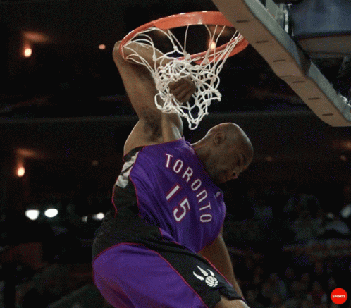A Man In A Toronto 15 Jersey Dunks A Ball GIF