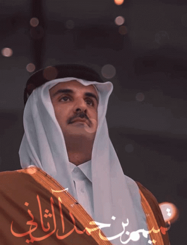 A Man In A Traditional Costume With Arabic Writing On It GIF