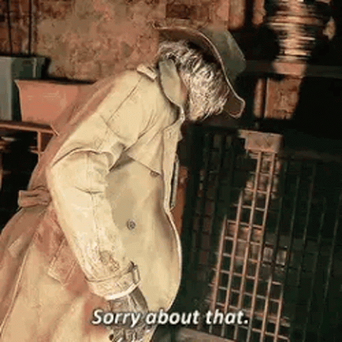 A Man In A Trench Coat And Hat Is Standing In Front Of A Fireplace And Saying Sorry About That . GIF