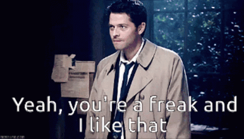 A Man In A Trench Coat And Tie Is Saying " Yeah You 'Re A Freak And I Like That " GIF