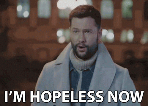 A Man In A Trench Coat Is Saying I 'M Hopeless Now GIF