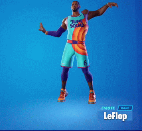 A Man In A Tune Squad Jersey Is Dancing GIF