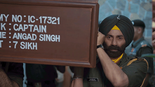 A Man In A Turban Holds Up A Sign That Says My No Ic-17321 GIF