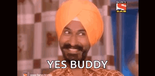 A Man In A Turban Is Smiling And Says Yes Buddy . GIF