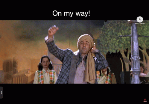 A Man In A Turban Is Waving His Hand With The Words On My Way Above Him GIF